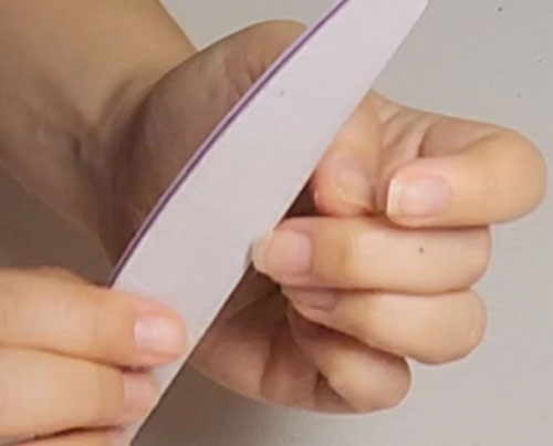 File and shape nails natural manicure